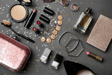 Flat lay composition with cosmetics and stylish accessories on grey background