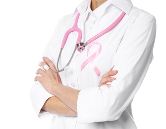 Photo of Female doctor with pink ribbon and stethoscope on white background, closeup. Breast cancer concept