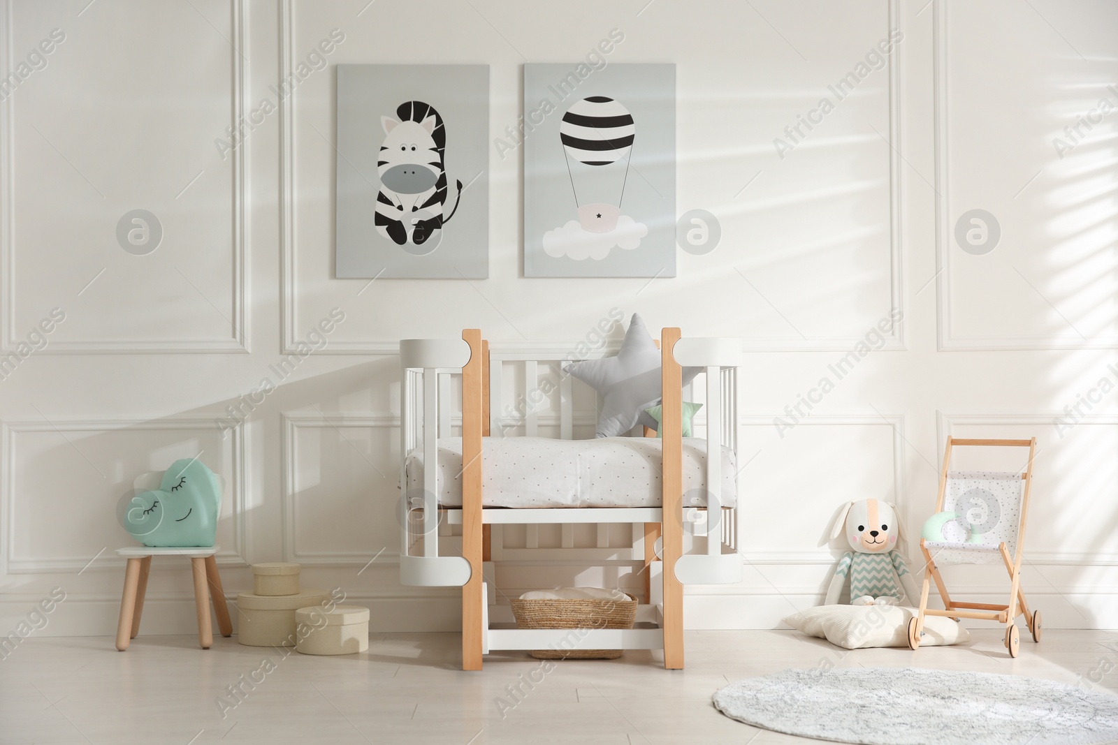 Photo of Baby room interior with stylish furniture and toys