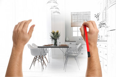 Image of Man drawing kitchen interior design. Combination of photo and sketch