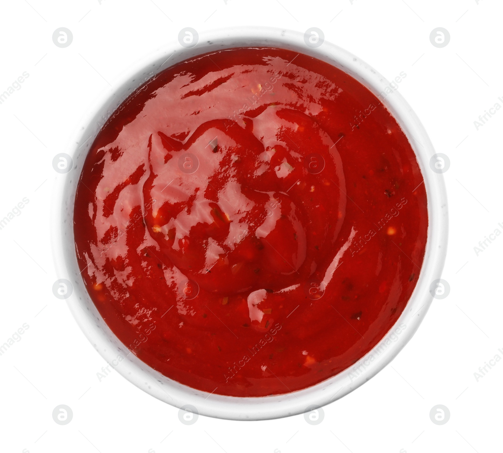 Photo of Bowl with red sauce isolated on white, top view