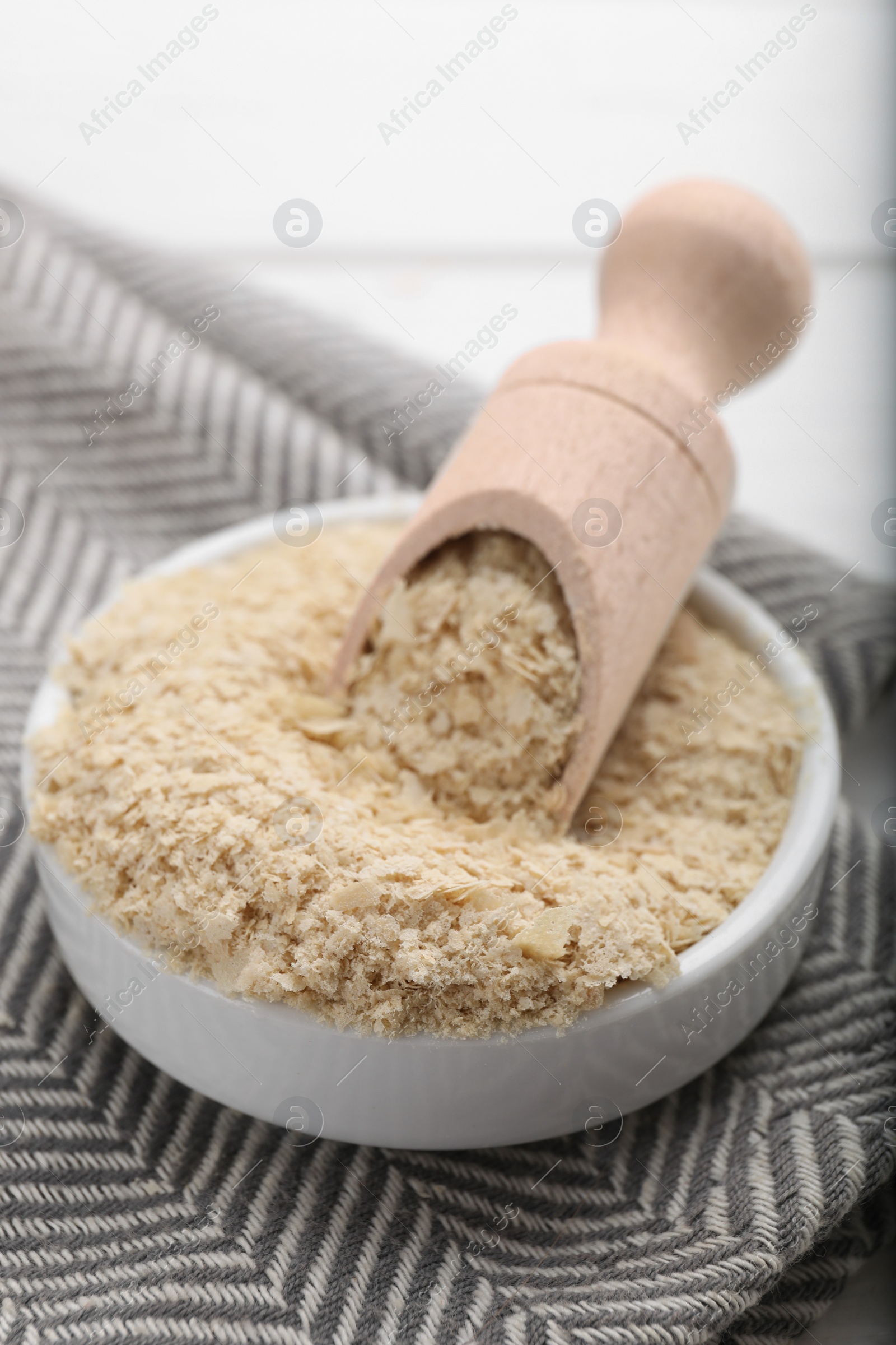 Photo of Beer yeast flakes on white table, closeup