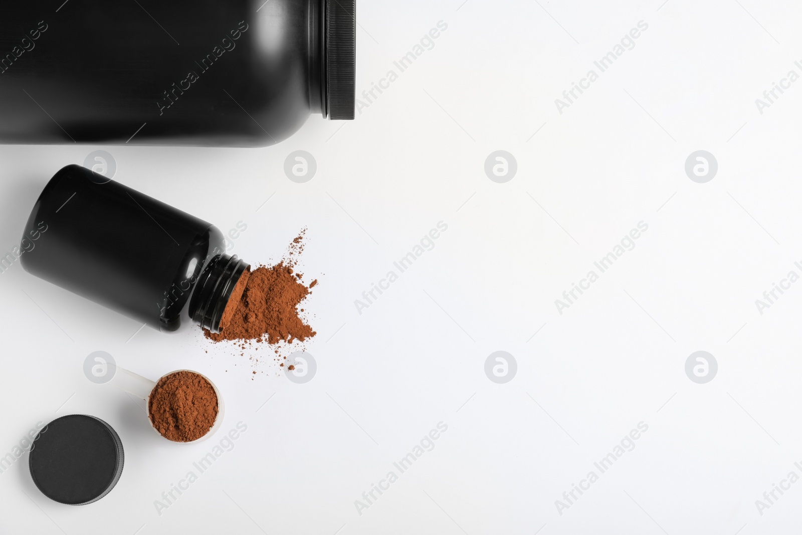 Photo of Flat lay composition with protein powder on white background. Space for text