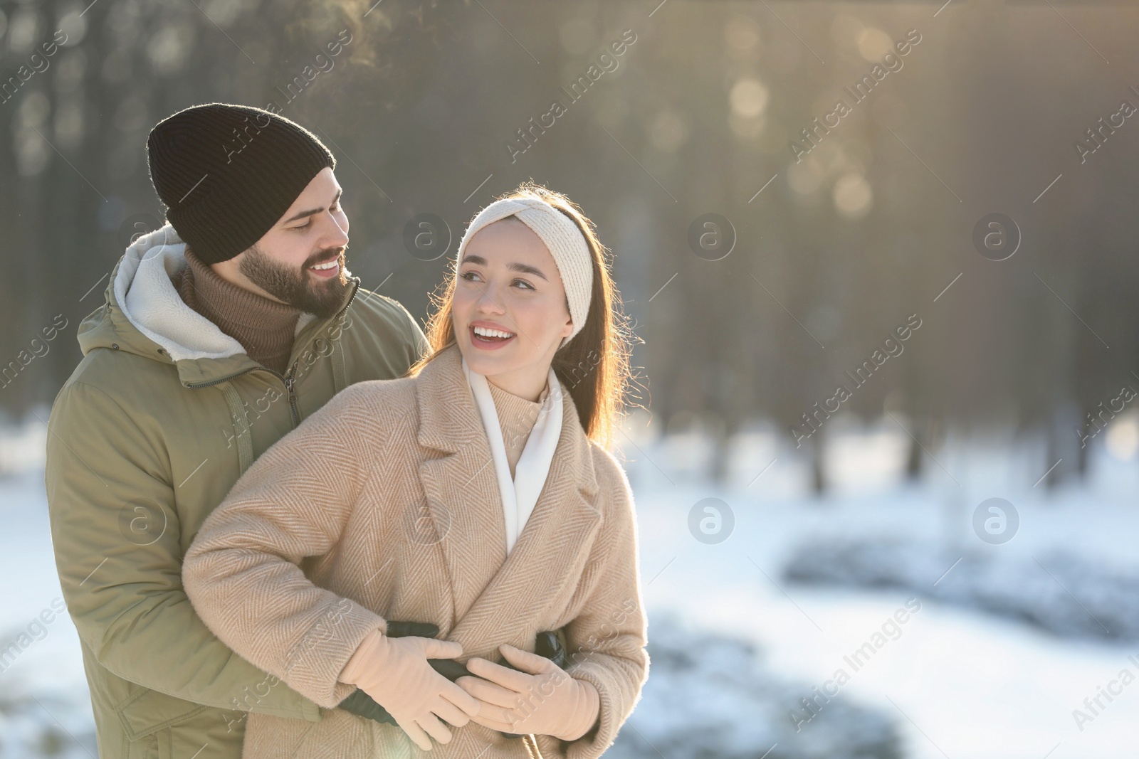 Photo of Beautiful young couple enjoying winter day outdoors