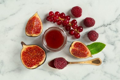 Photo of Jar of sweet jam and ingredients on white marble table, flat lay