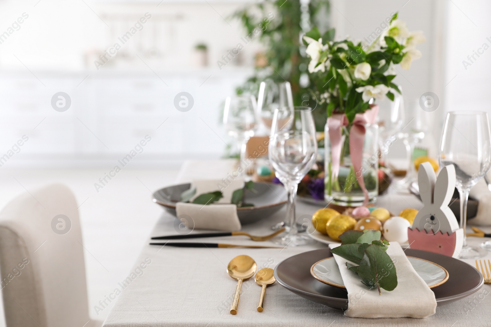 Photo of Beautiful Easter table setting with festive decor indoors