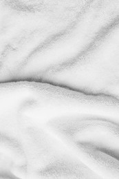 Soft white towel as background, top view