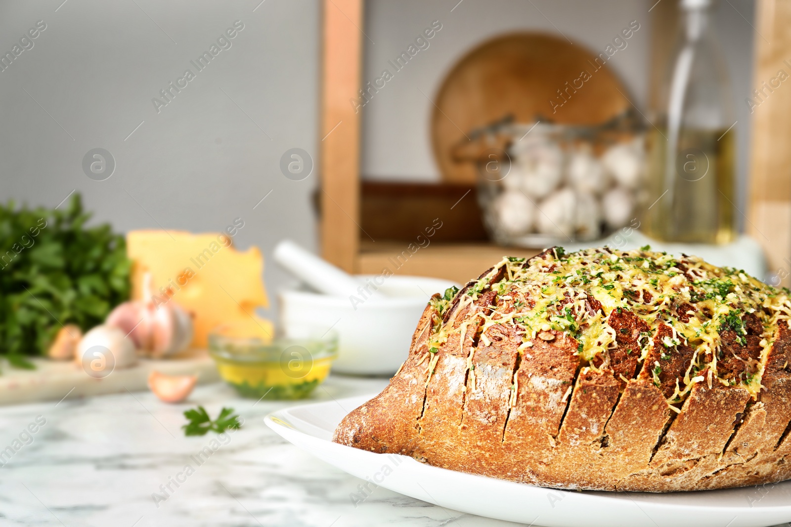 Photo of Tasty homemade garlic bread with cheese and herbs on marble table. Space for text