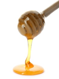 Photo of Honey dripping from dipper on white background