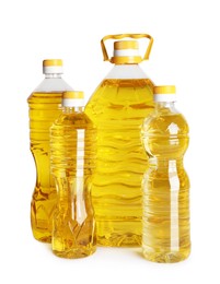 Bottles of cooking oil on white background