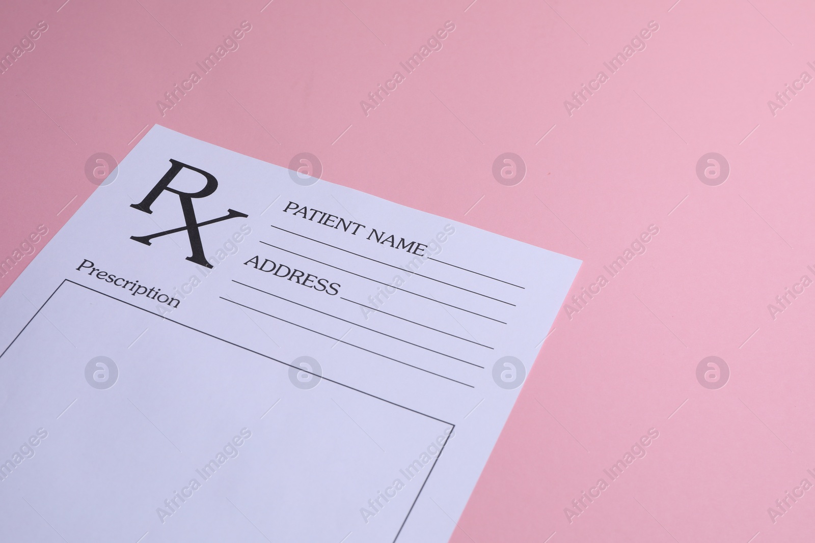 Photo of Medical prescription form on pink background. Space for text