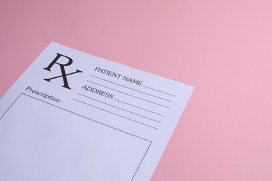 Medical prescription form on pink background. Space for text