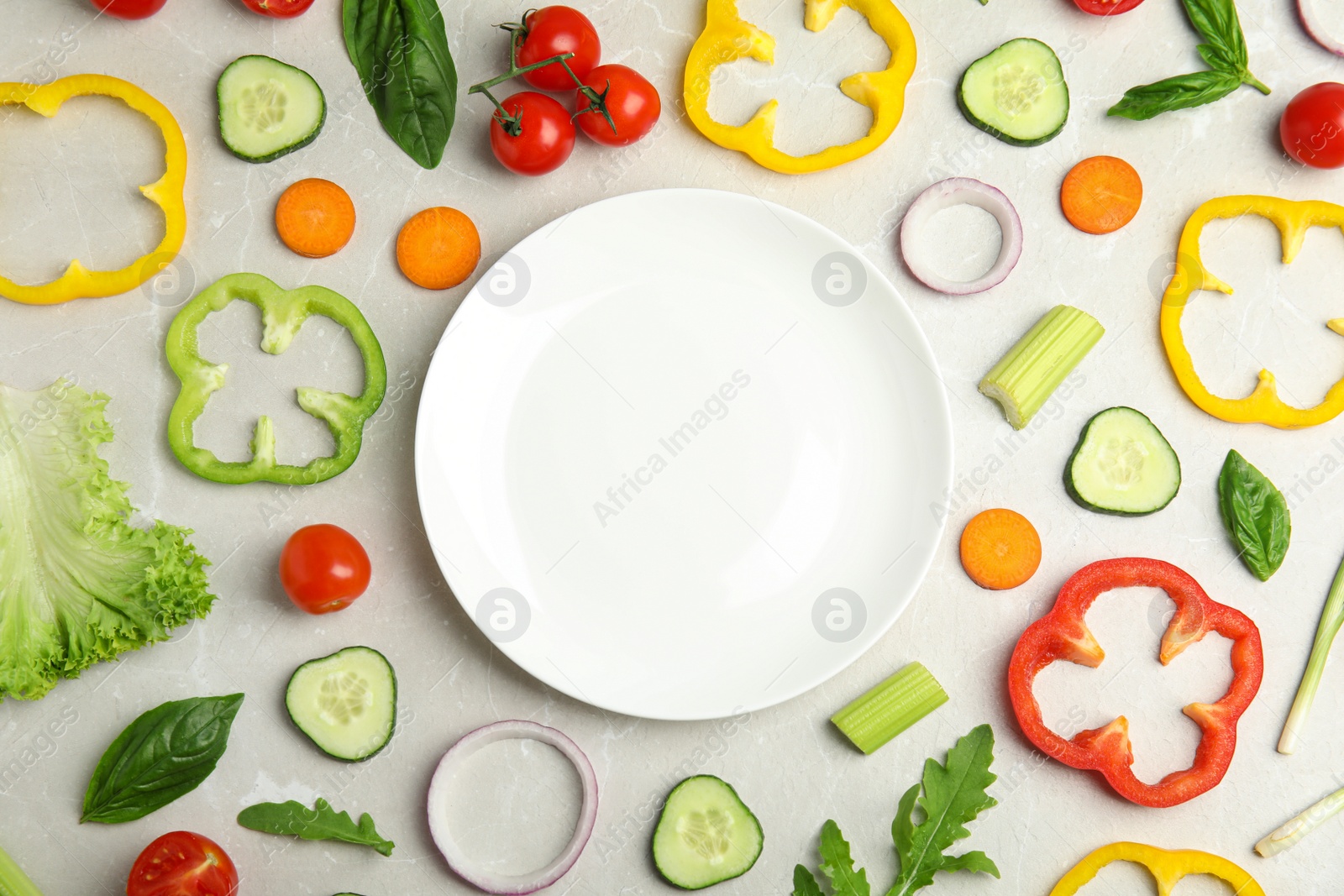 Photo of Flat lay composition with fresh salad ingredients on white wooden table, space for text
