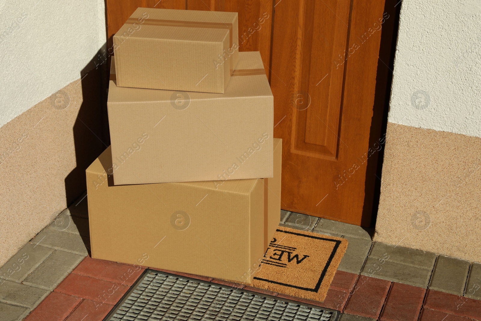 Photo of Parcels delivered on mat near front door