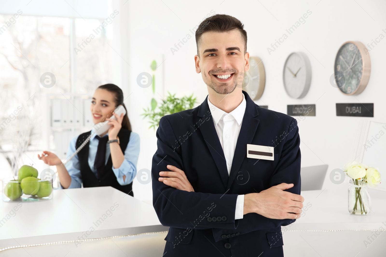 Photo of Portrait of male receptionist at workplace in hotel