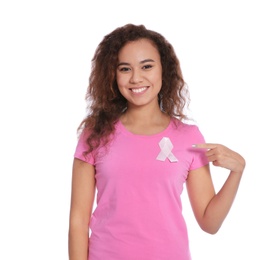 Photo of African-American woman with silk ribbon on white background. Breast cancer awareness concept