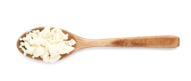 Delicious fresh cottage cheese in spoon isolated on white, top view