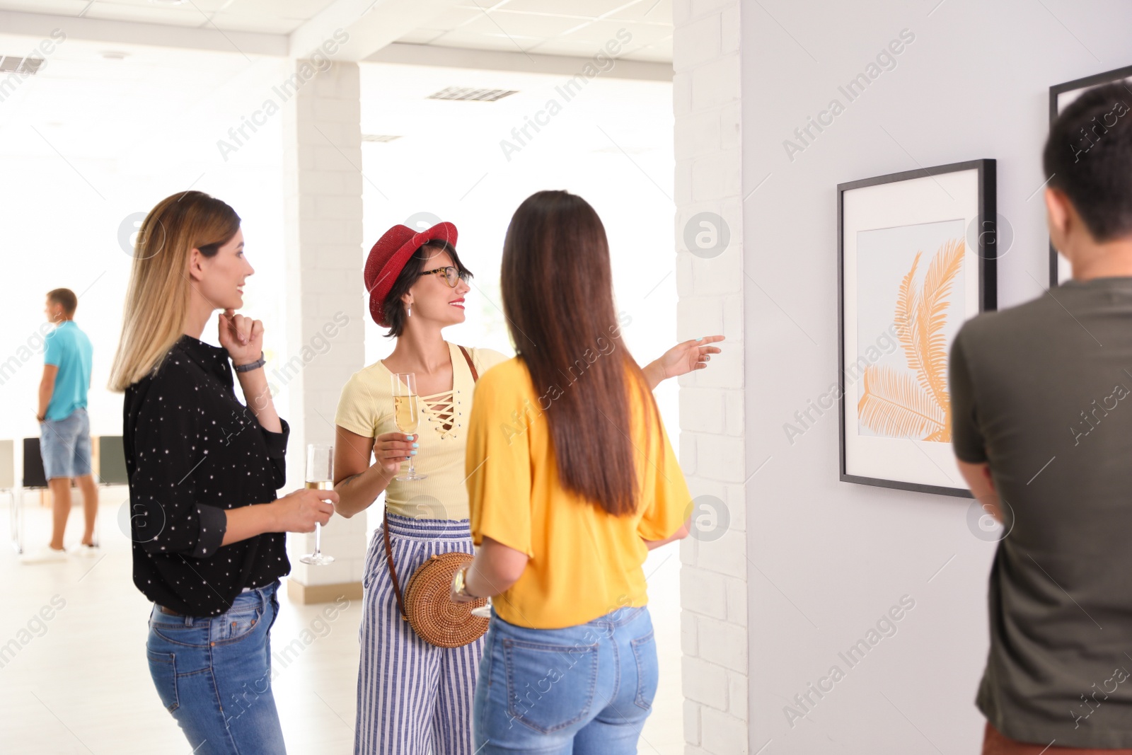 Photo of Beautiful women at exhibition in art gallery