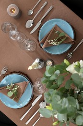 Festive table setting with beautiful tableware and decor, top view