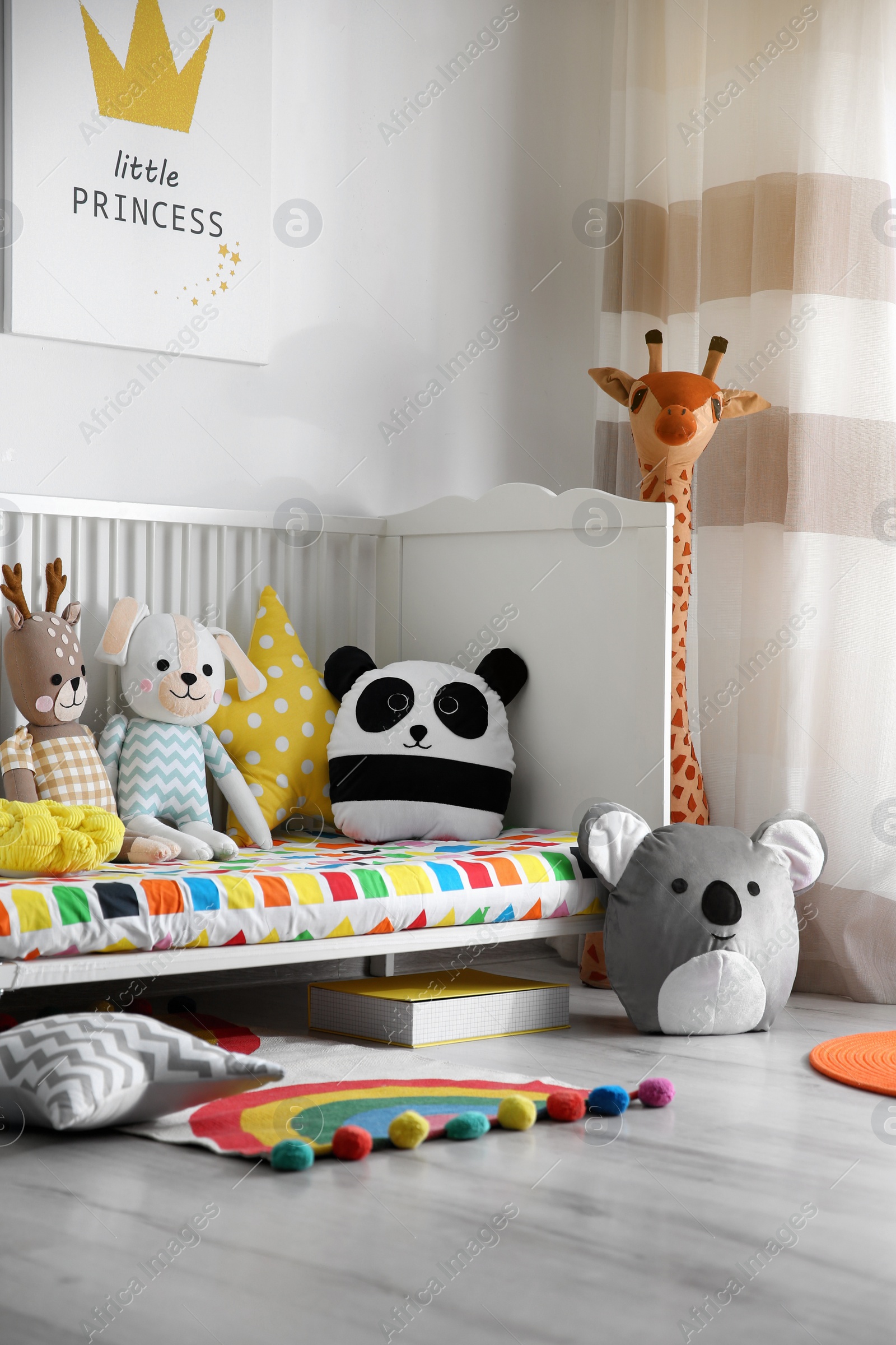 Photo of Baby room interior with stylish furniture and toys