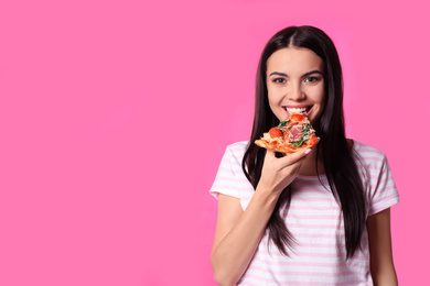 Beautiful woman with pizza on pink background, space for text