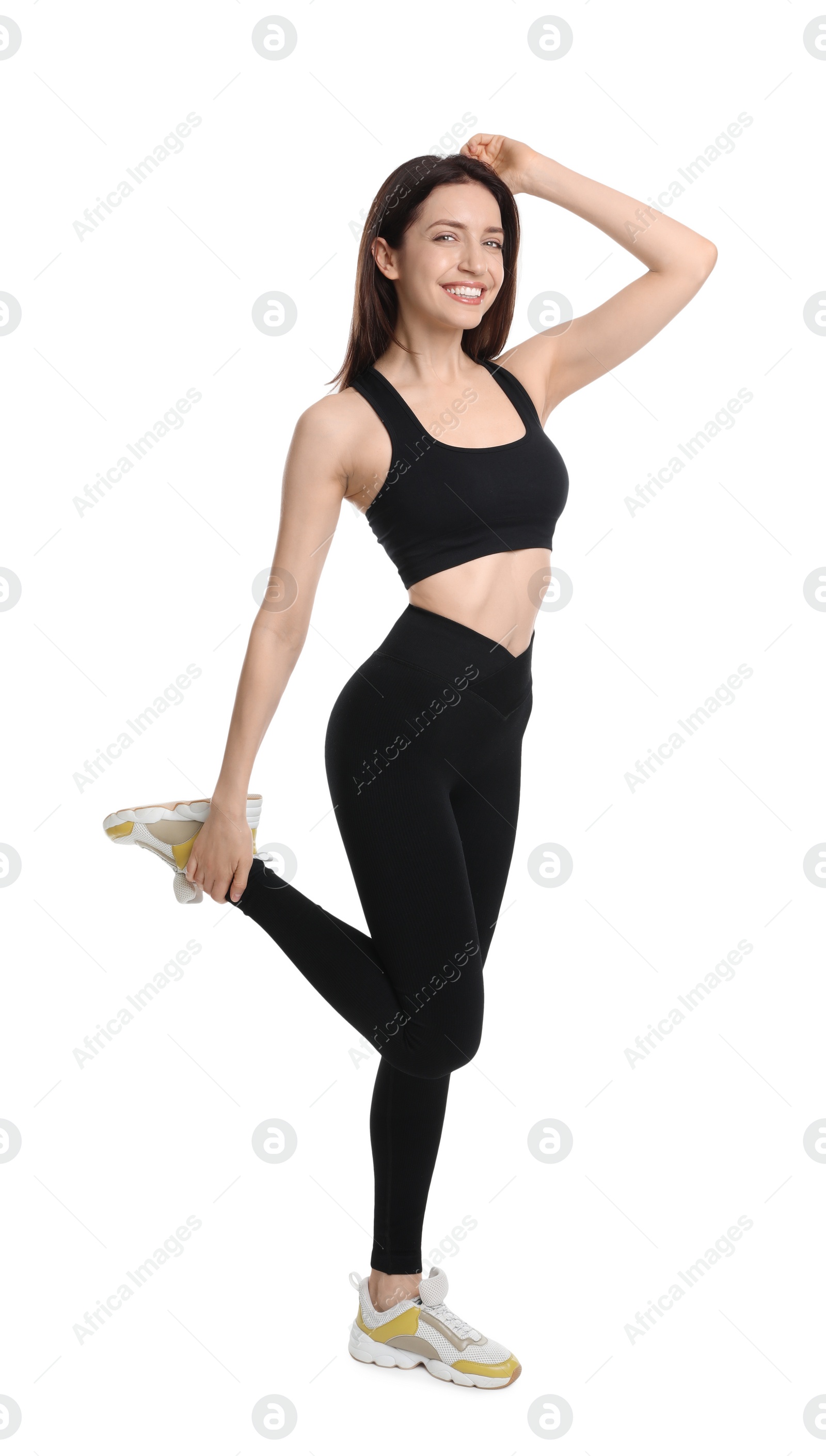 Photo of Happy young woman with slim body posing on white background