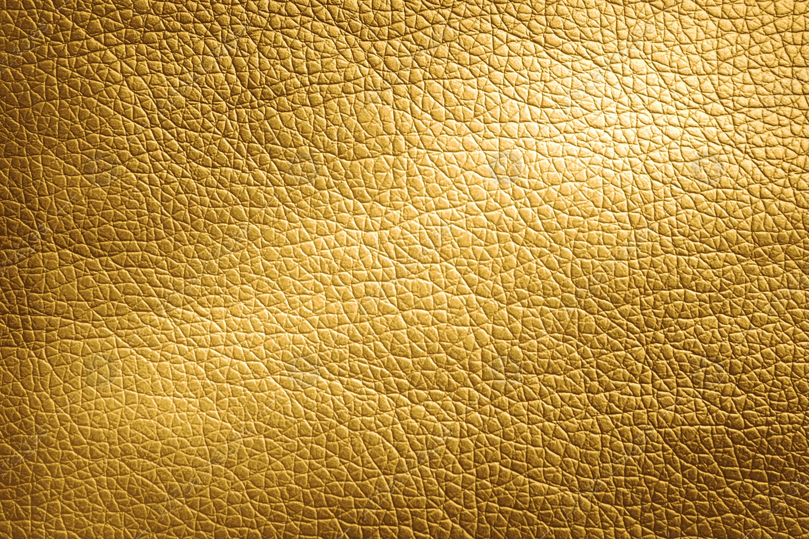 Image of Golden textured surface as background, closeup view