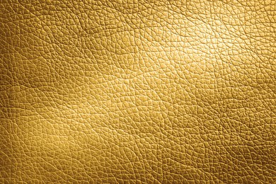 Image of Golden textured surface as background, closeup view