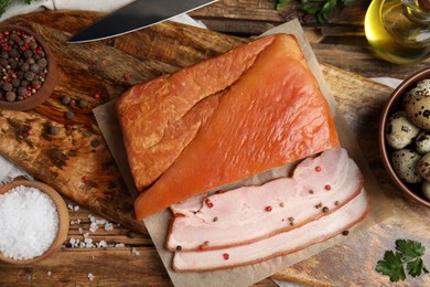 Photo of Flat lay composition with delicious smoked bacon on wooden table