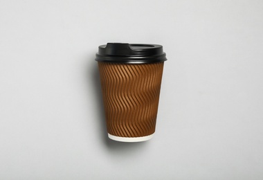 Takeaway paper coffee cup on light grey background, top view
