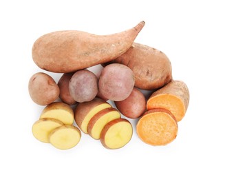 Different types of fresh potatoes on white background, top view