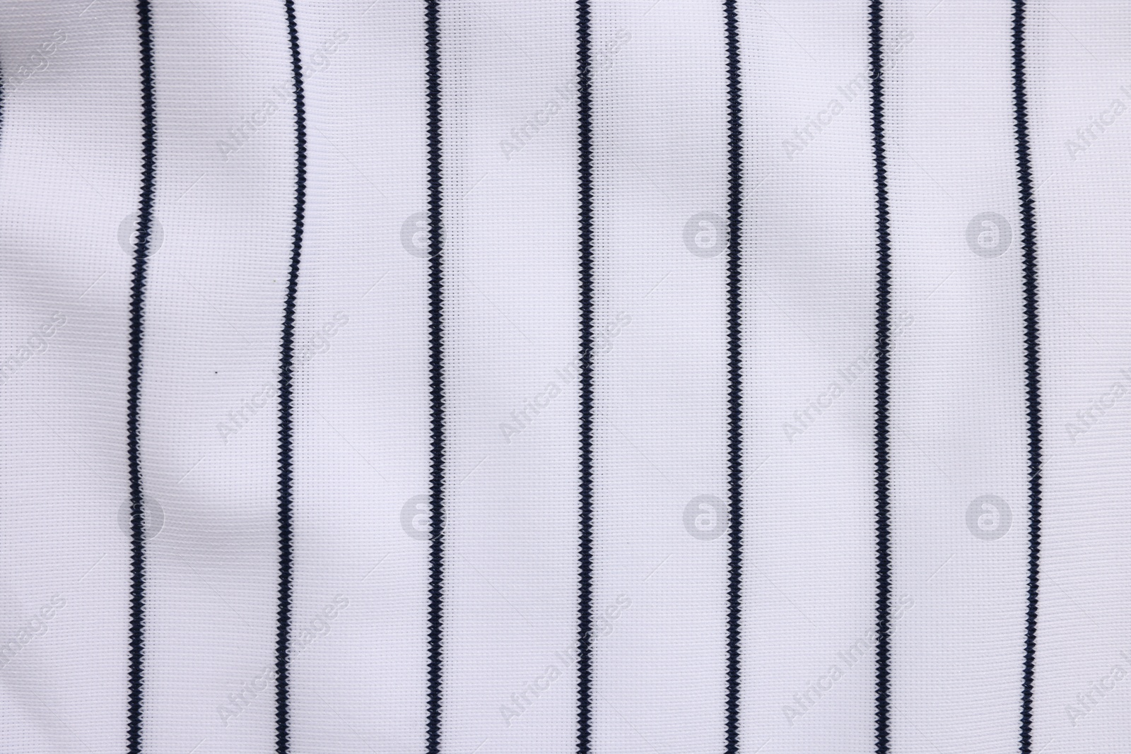 Photo of Striped baseball uniform as background, top view