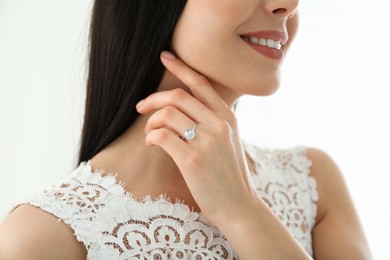 Young bride wearing beautiful engagement ring, closeup