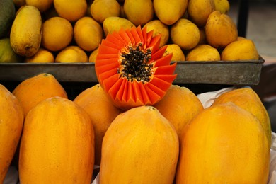 Photo of Pile of delicious fresh ripe papayas at market