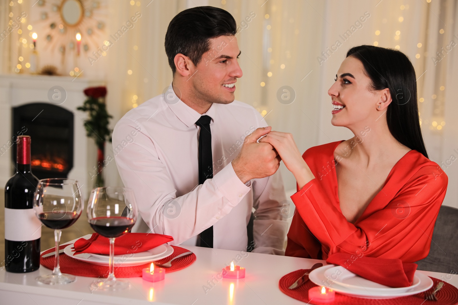 Photo of Happy couple having romantic dinner on Valentine's day in restaurant