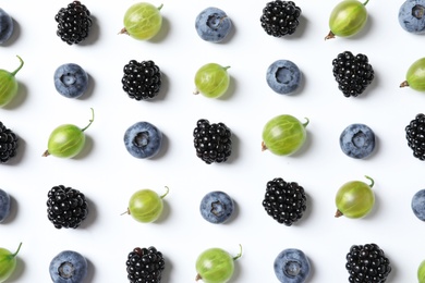 Photo of Composition with gooseberries, blackberries and blueberries on white background