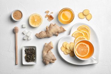 Flat lay composition with tea and therapeutic products on white background