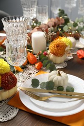 Photo of Beautiful autumn table setting. Plates, cutlery, glasses and floral decor