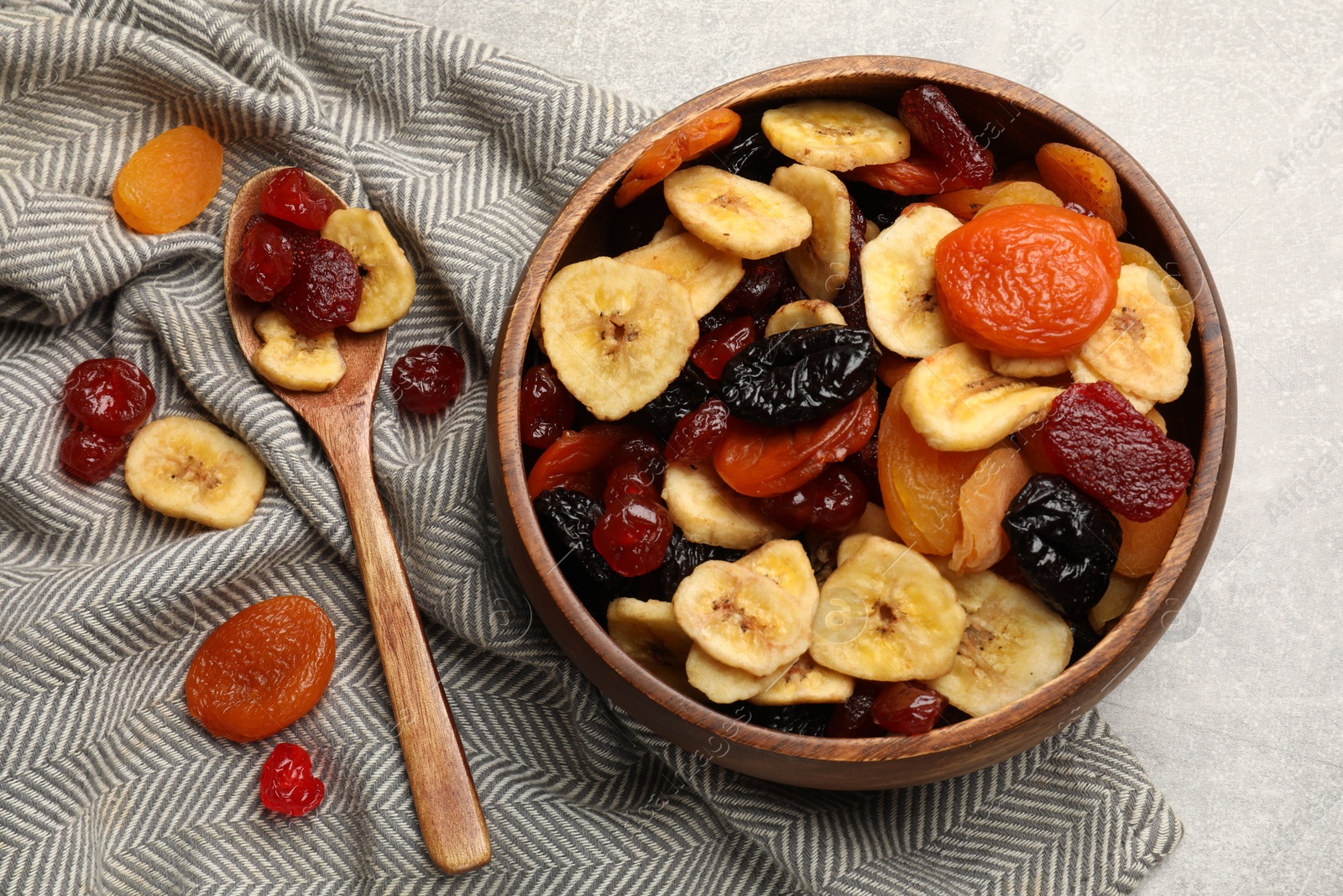 Photo of Mix of delicious dried fruits on table, flat lay