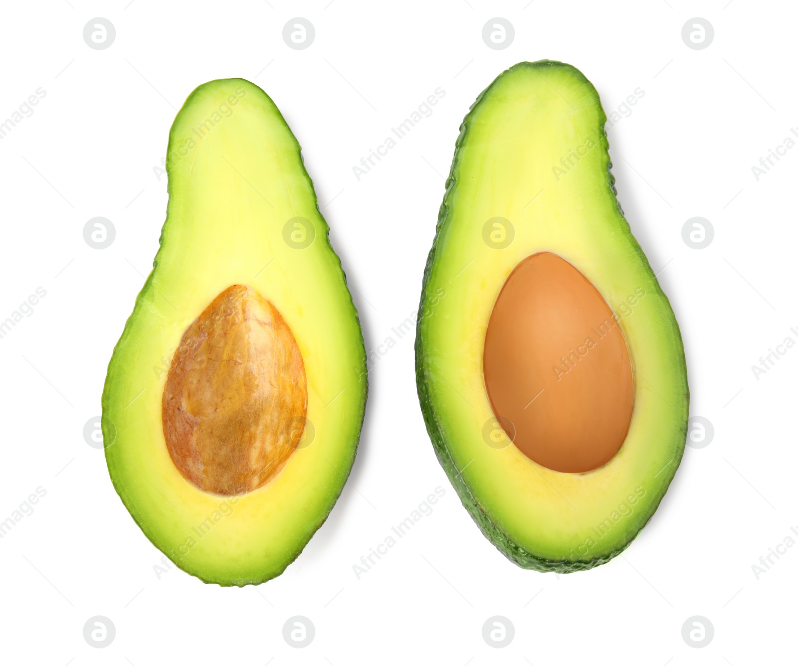 Photo of Cut tasty ripe avocados on white background, top view. Tropical fruit