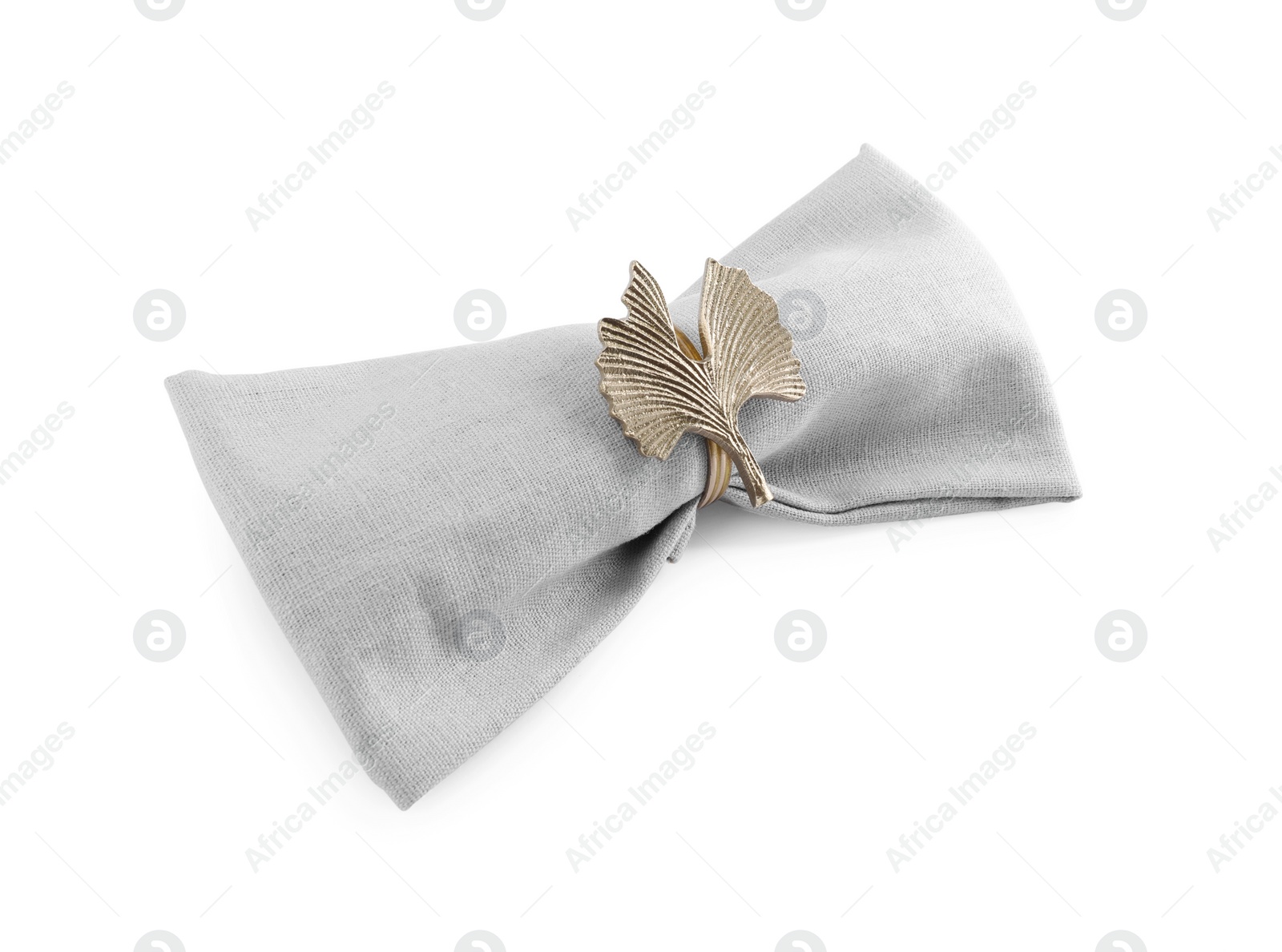 Photo of Napkin with decorative ring for table setting isolated on white