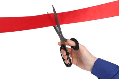 Man cutting red ribbon on white background, closeup