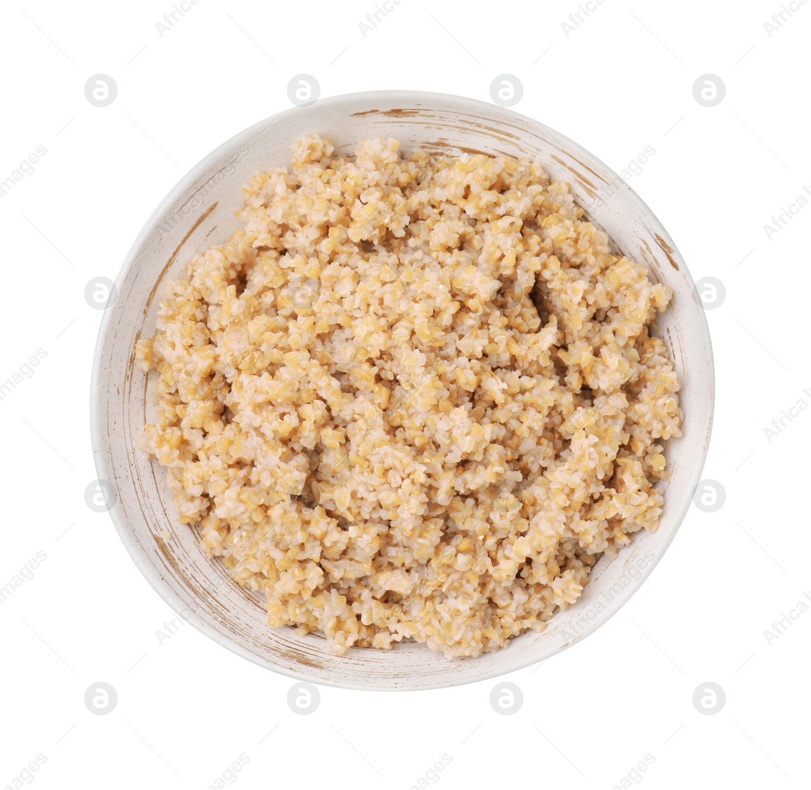 Photo of Tasty wheat porridge in bowl isolated on white, top view