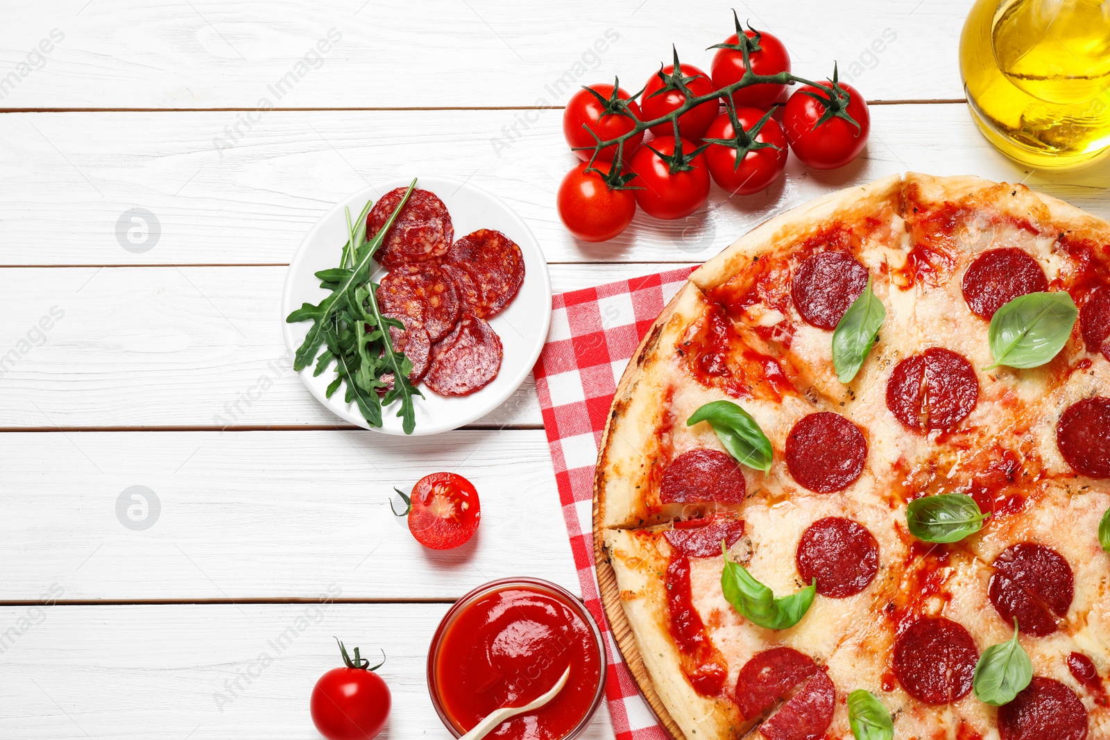 Photo of Flat lay composition with hot pepperoni pizza on white wooden table