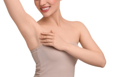 Beautiful woman showing armpit with smooth clean skin on white background