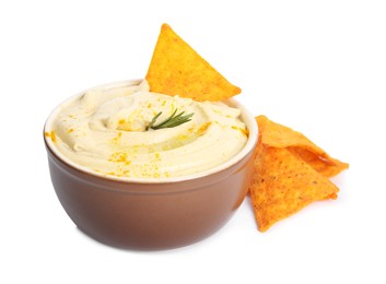 Photo of Delicious hummus with nachos and rosemary on white background