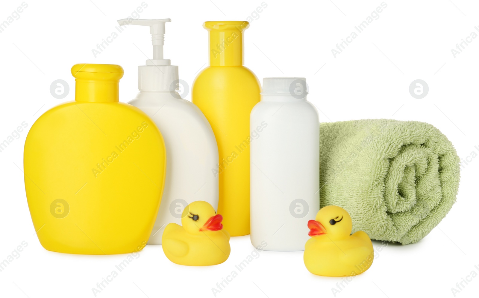 Photo of Bottles of baby cosmetic products, towel and rubber ducks on white background