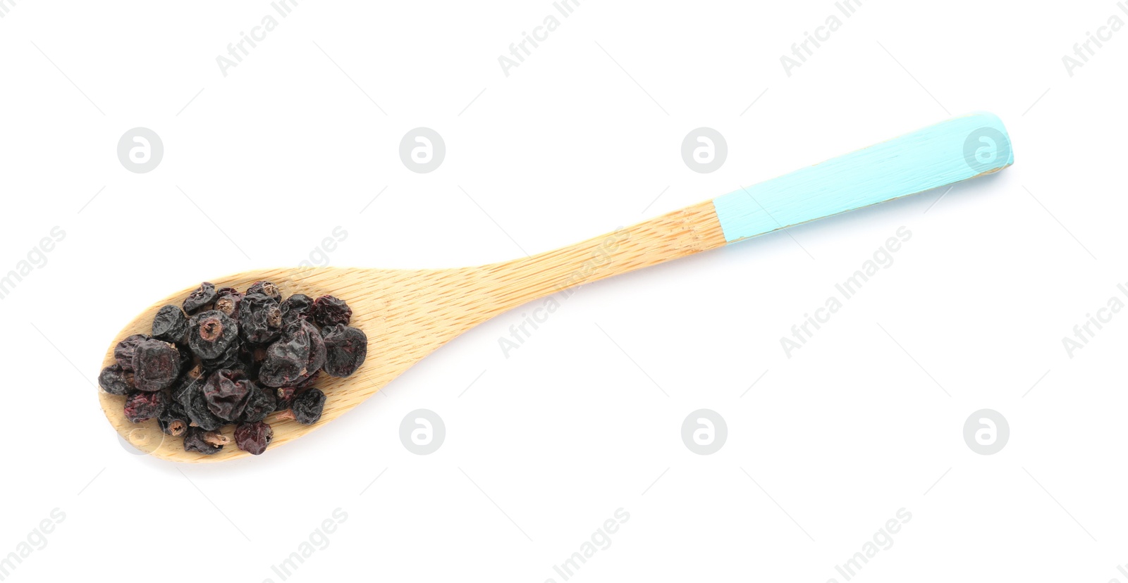 Photo of Dried black currants in wooden spoon isolated on white, top view