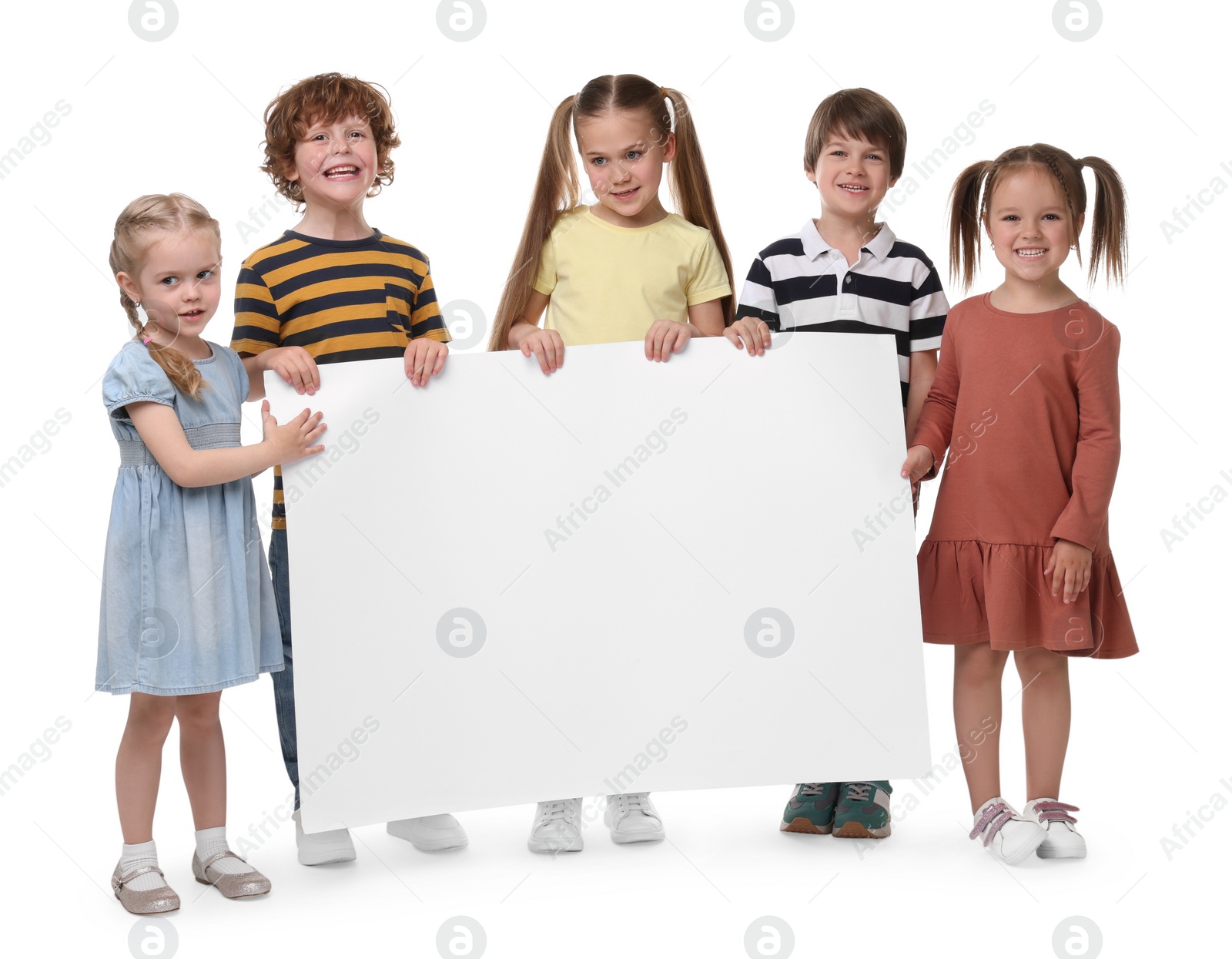 Photo of Group of children with blank poster on white background. Mockup for design