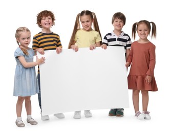 Group of children with blank poster on white background. Mockup for design